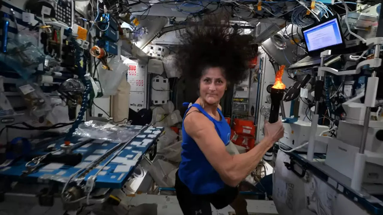 Sunita Williams passes the torch to space station astronauts in mock Olympics. | NASA