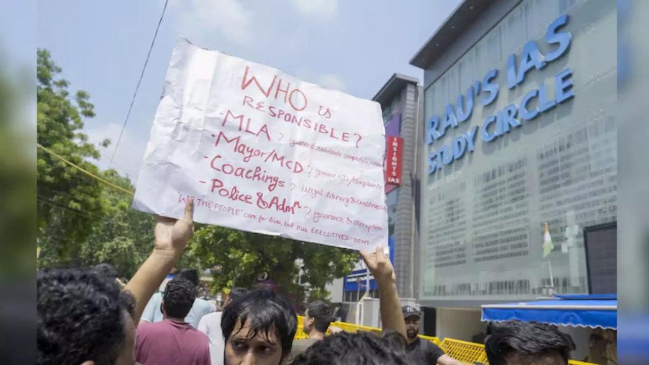 A student during a protest after three civil services aspirants died due to drowning at a coaching centre in Old Rajender Nagar area in New Delhi