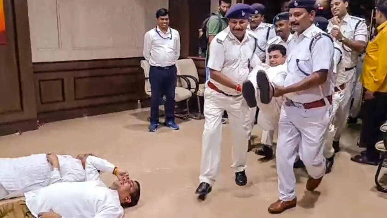 Marshals bring Jharkhand BJP MLAs out of the Jharkhand Legislative Assembly during their protest amid the ongoing Monsoon session, in Ranchi, Wednesday