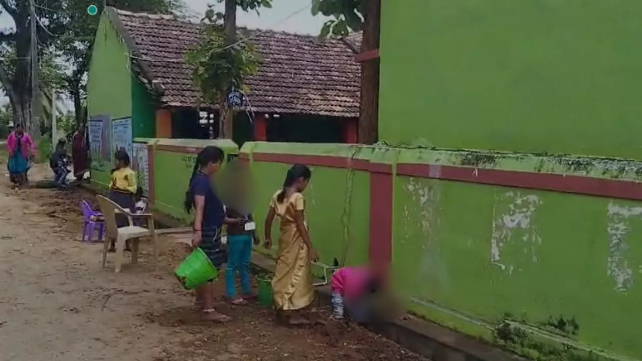 Karnataka children forced to clear drain.