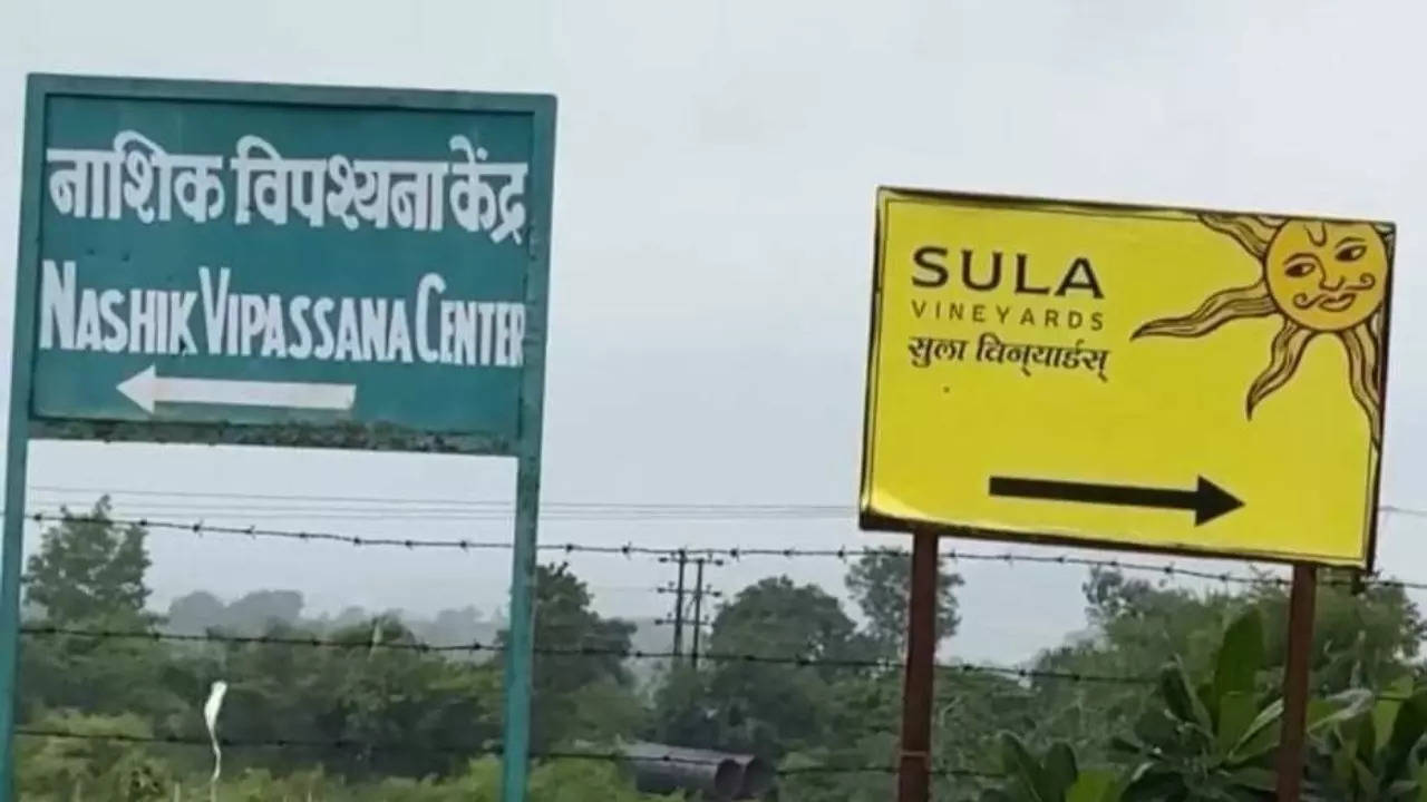 Nashik Vipassana Center and Sula Vineyards road signs pictured together in Nashik. | Rajiv Mehta/X