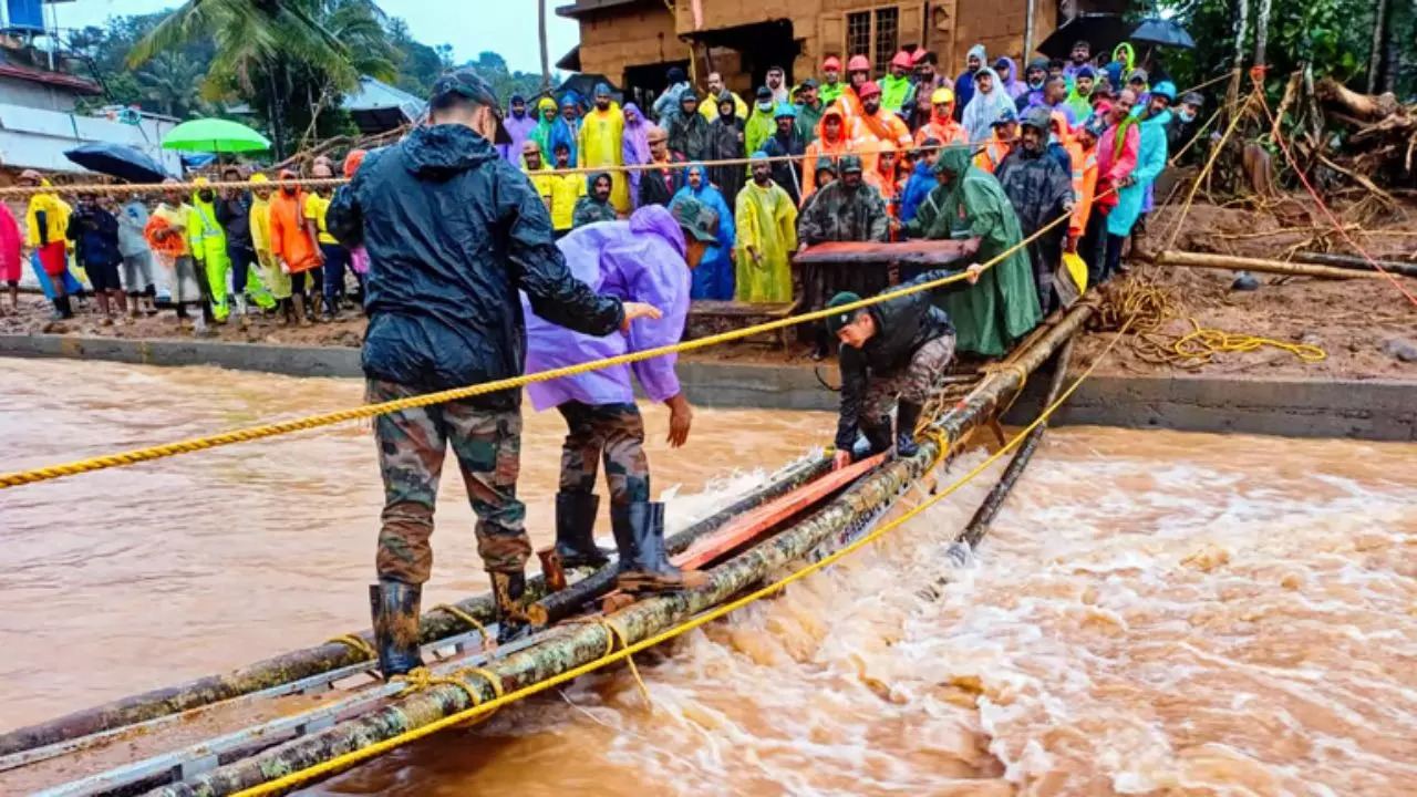 National Disaster Response Force (NDRF) personnel conduct rescue operation after landslides in the hilly areas near Meppadi, in Wayanad district of Kerala