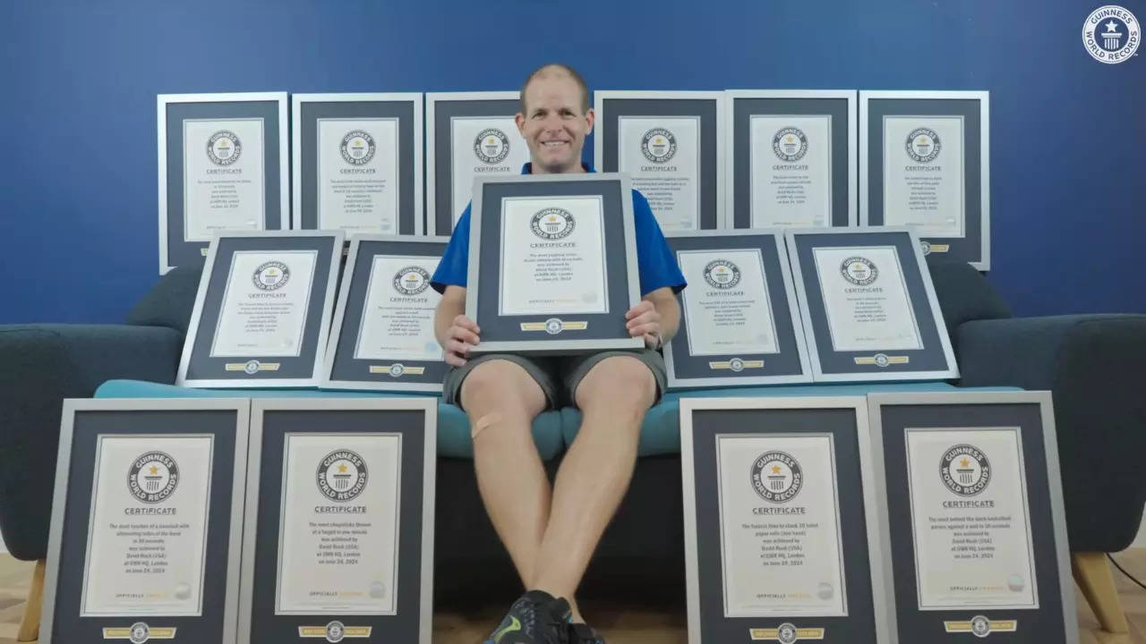 David Rush pictured with his certificates for all the 15 records he set. | Guinness World Records