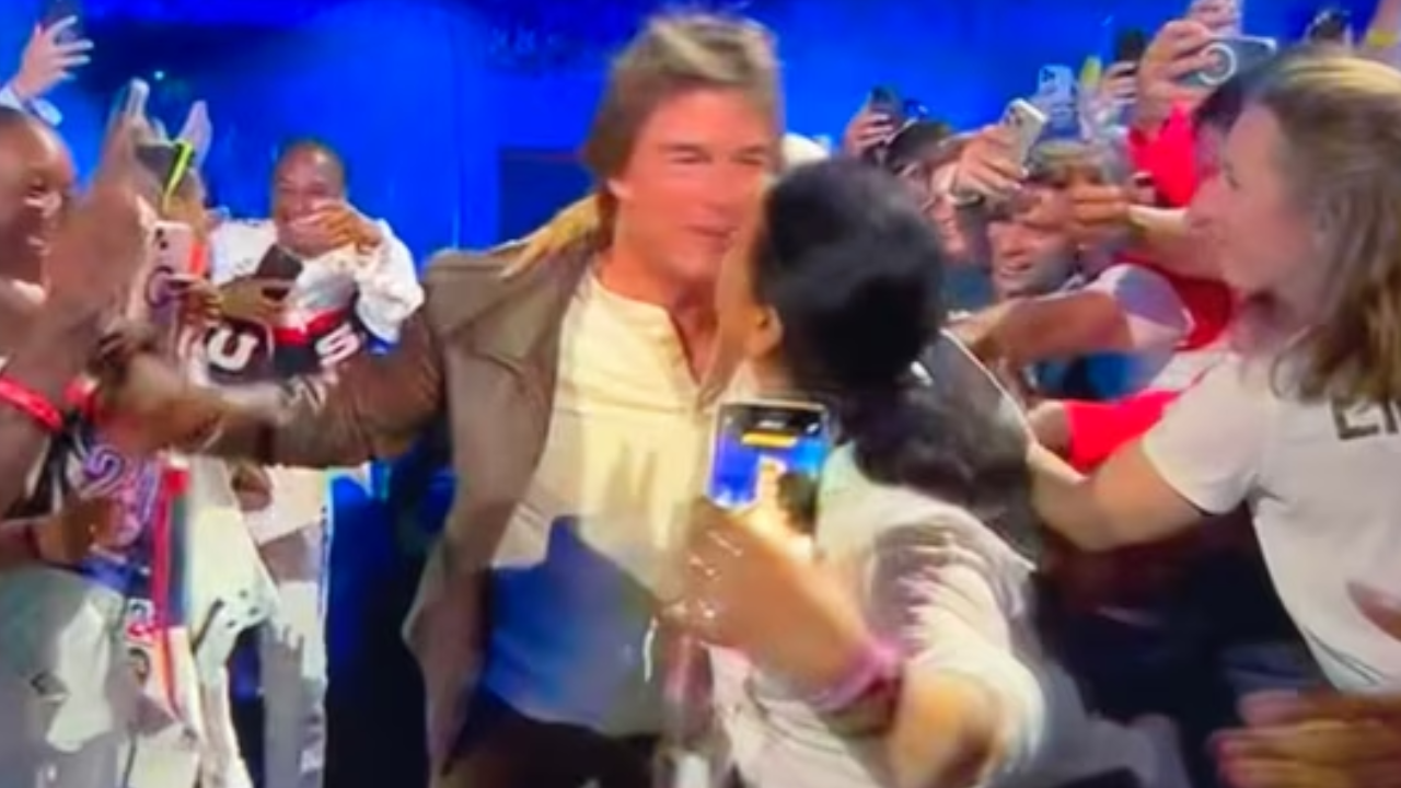 Woman Grabs Tom Cruise To Kiss Him