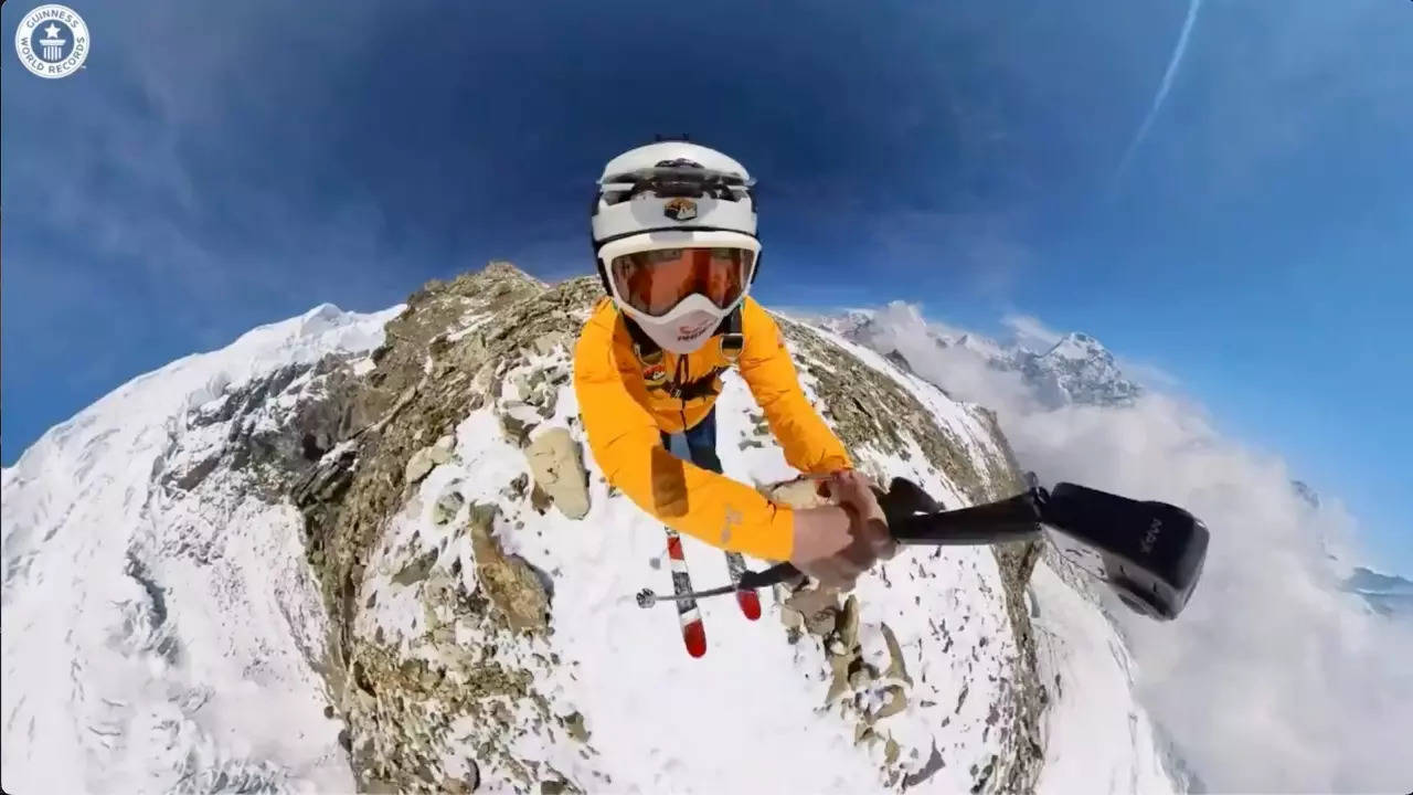 Joshua Bregmen freefalls off Mera Peak during the highest ski-BASE jump. | Guinness World Records