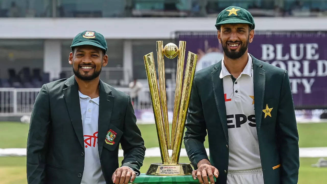 Bangladesh and Pakistan captains pose with the trophy ahead of Test series