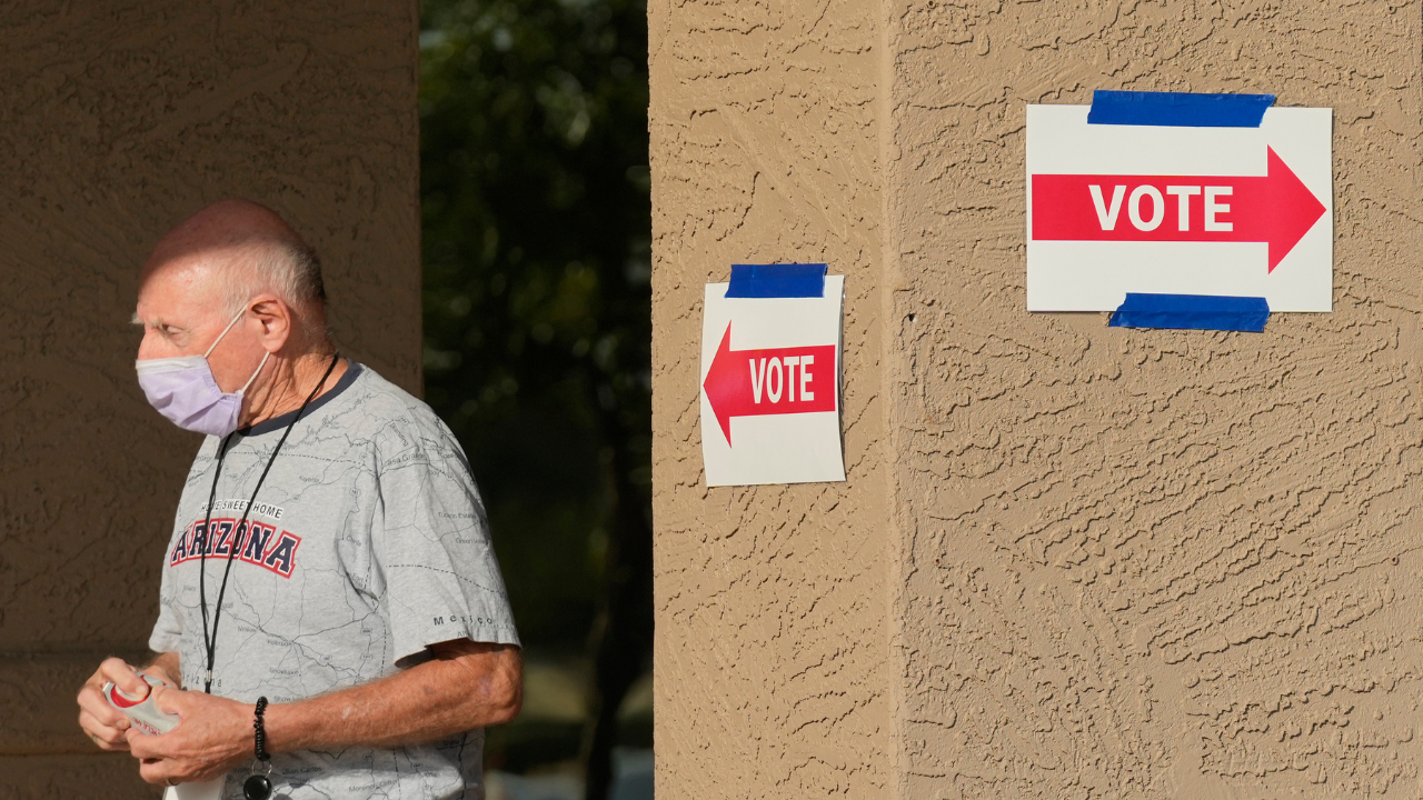 A precinct worker walks outside a voting location