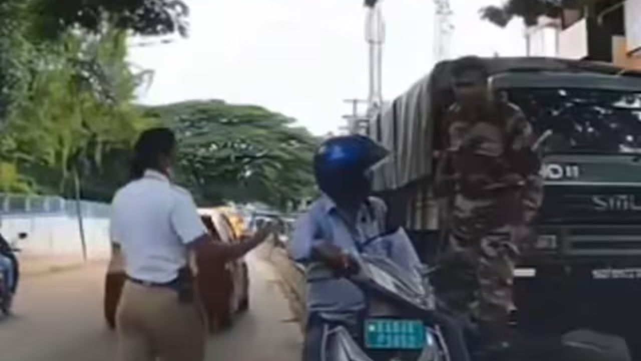 man riding scooter in wrong lane blocks traffic in bengaluru, gets thump on head by army jawan | watch