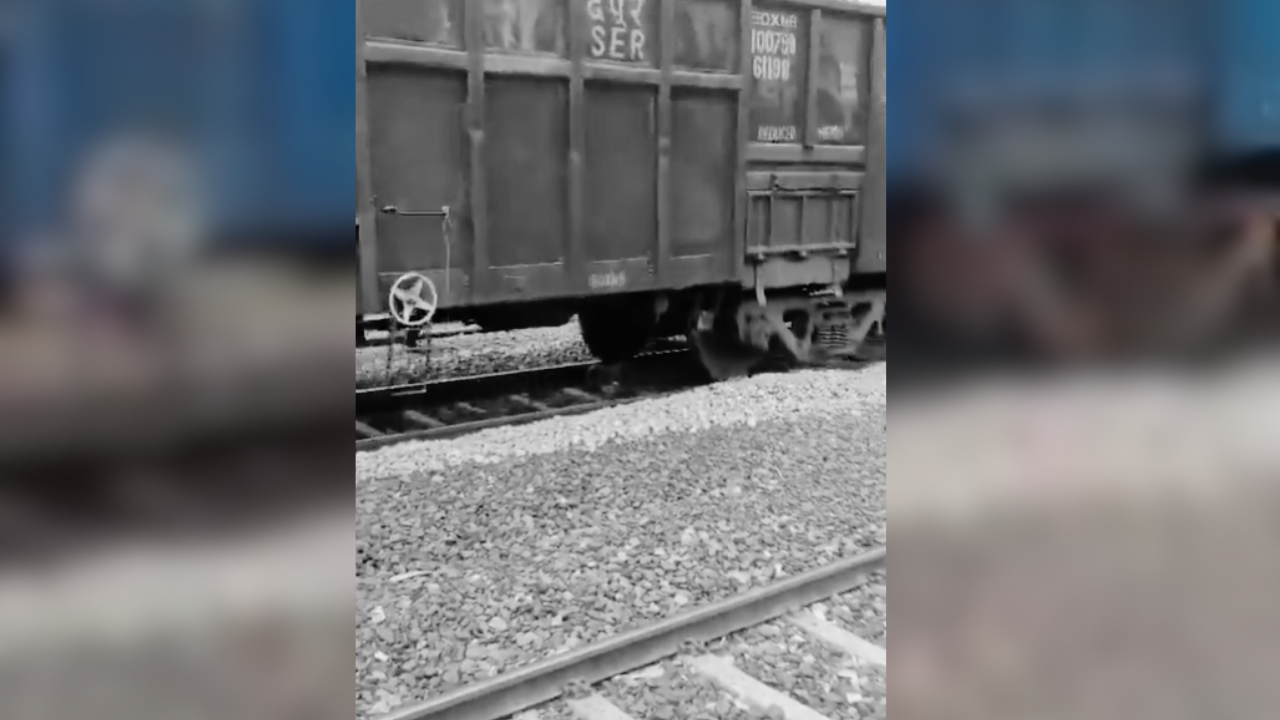 hyderabad woman survives train passing over her while lying on tracks in a viral video