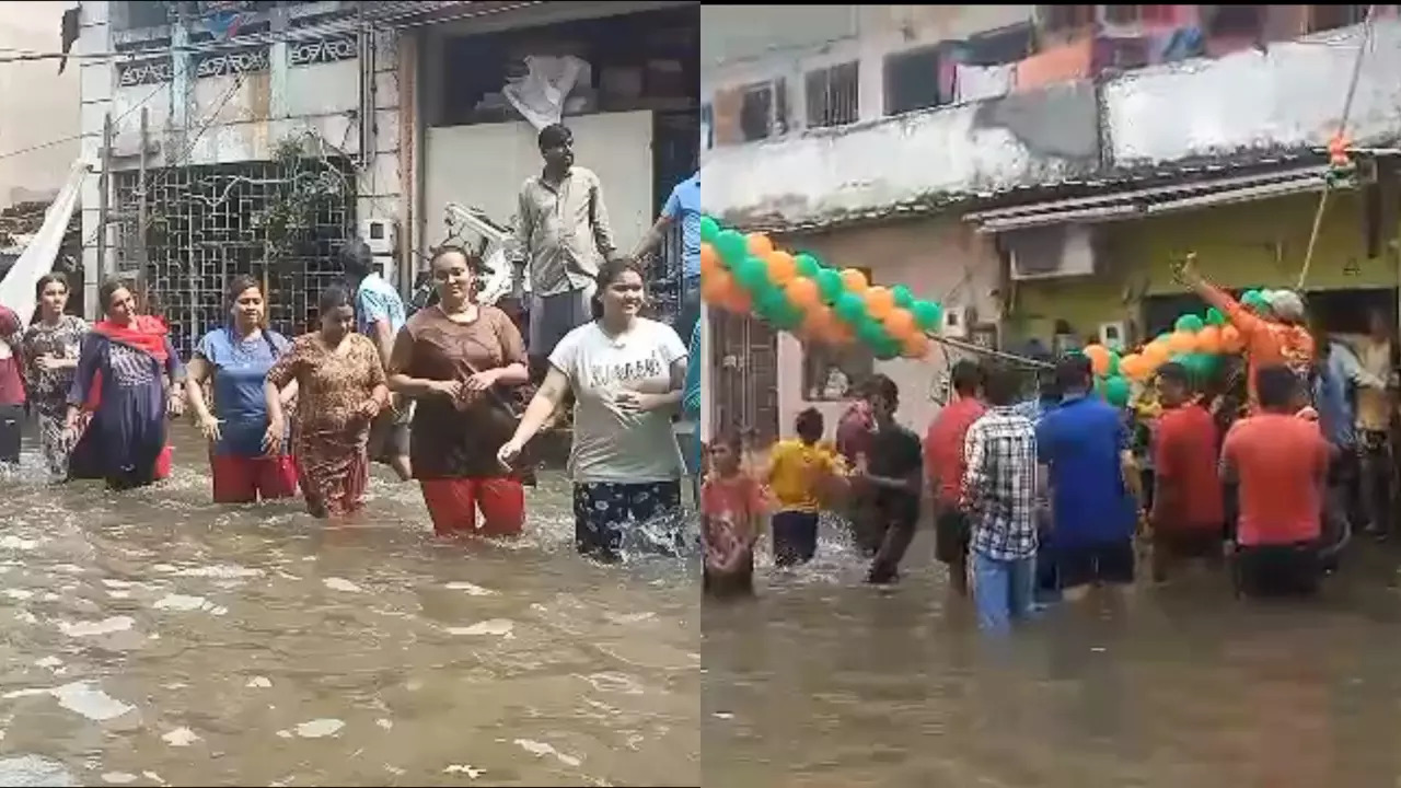 Residents of a Vadodara neighbourhood perform Garba knee-deep in floodwater. | Credit: Kiran Vaniya