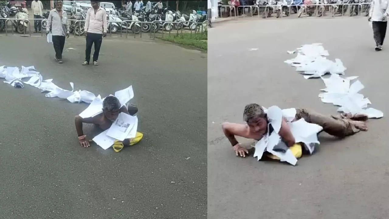 man wears garland of complaints rolls on ground in neemuch madhya pradesh