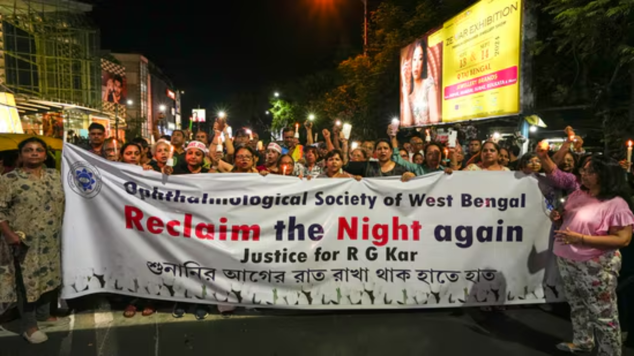 People hold banners during a candlelight march on Wednesday night