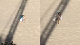 Viral Video Tower Crane Shadow Follows Sunbathing Woman as She Moves Spots