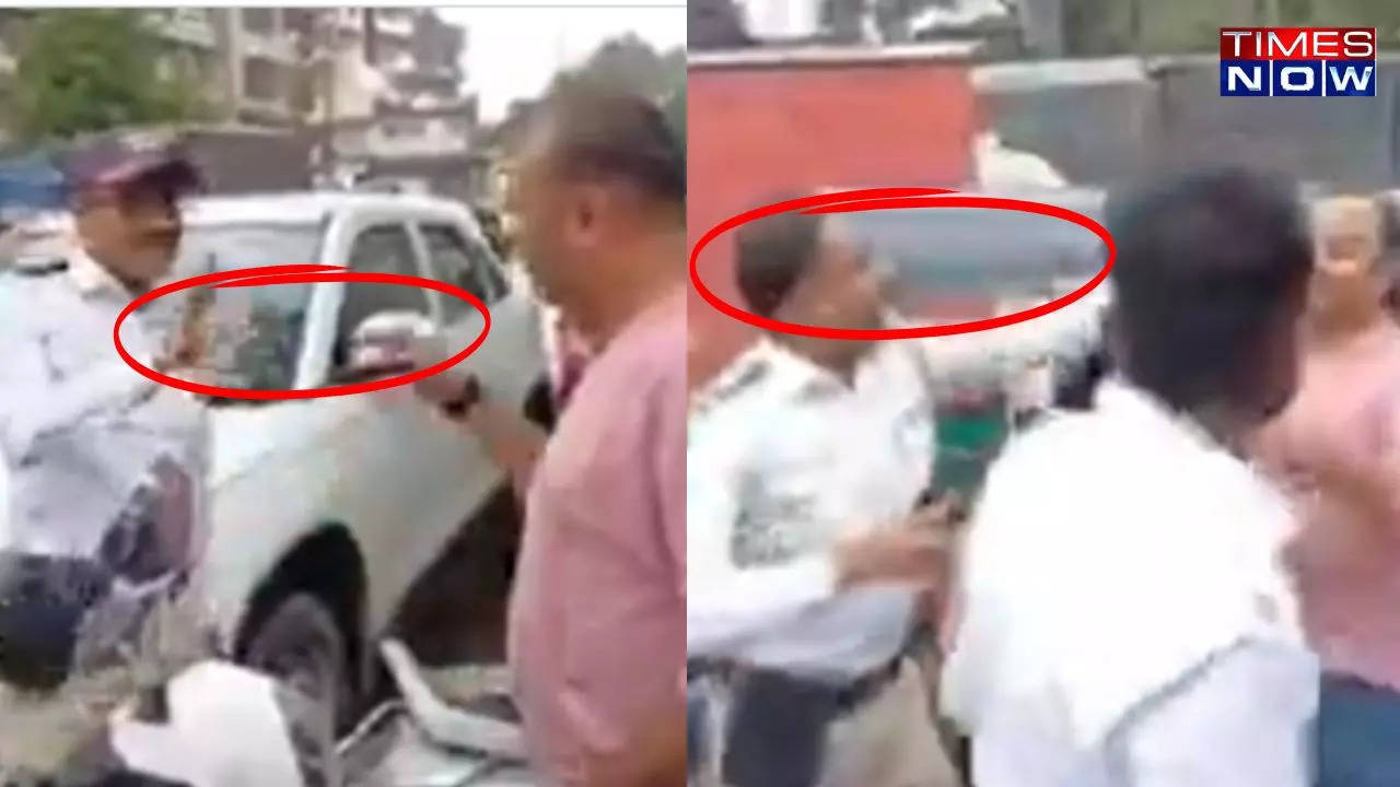 video: drunk auto rickshaw drivers slap and throw water at traffic cop in thane