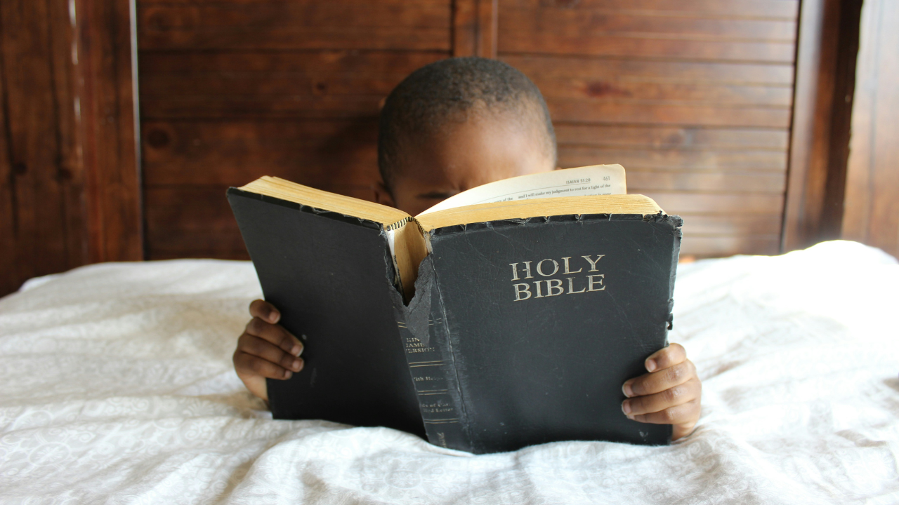 Child Reading Bible 