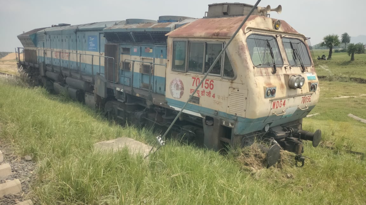 Train derails into field