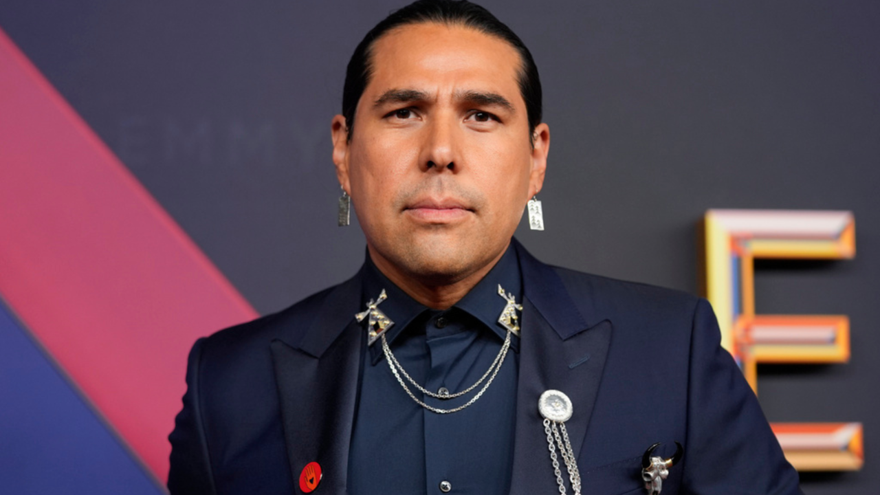 Dallas Goldtooth, star of Reservation Dogs, also showed his support by wearing a red Artists4Ceasefire pin on the red carpet. (AP)