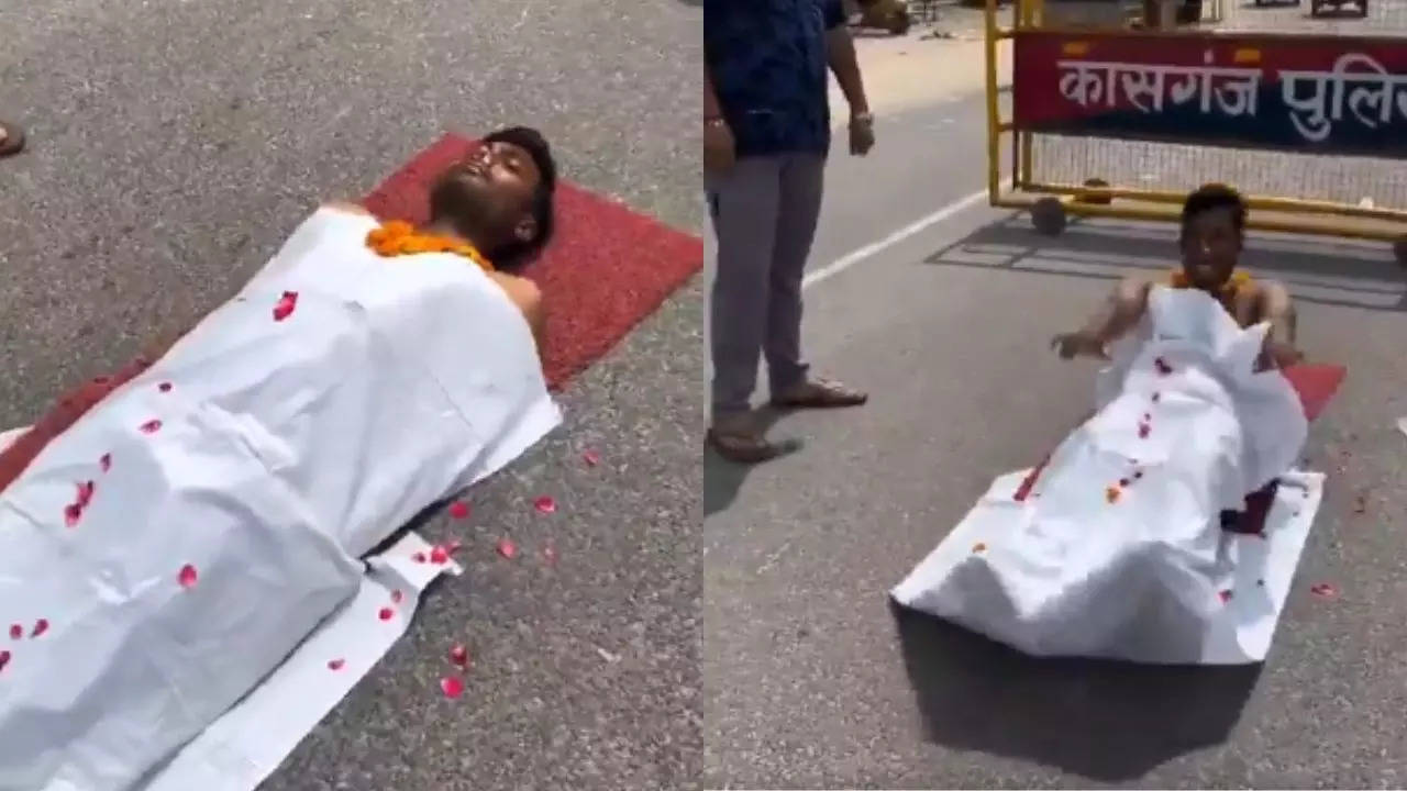 reel mania? 'dead man' gets up on up road, laughs with tongue out - video