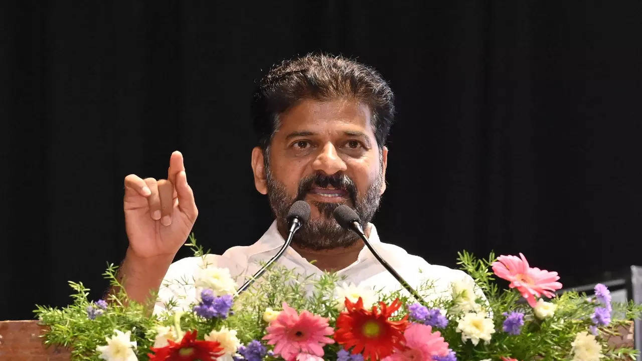 i am not farmhouse cm and delhi is not in pakistan says revanth reddy