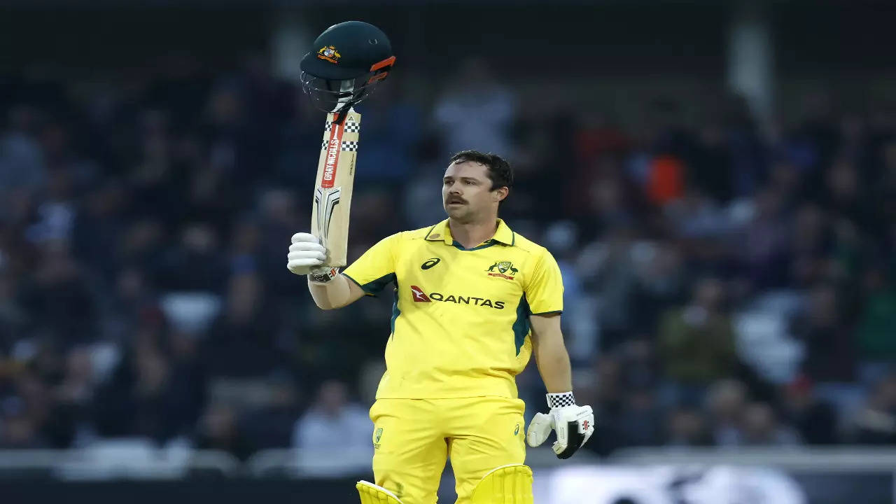 Travis Head celebrates his century