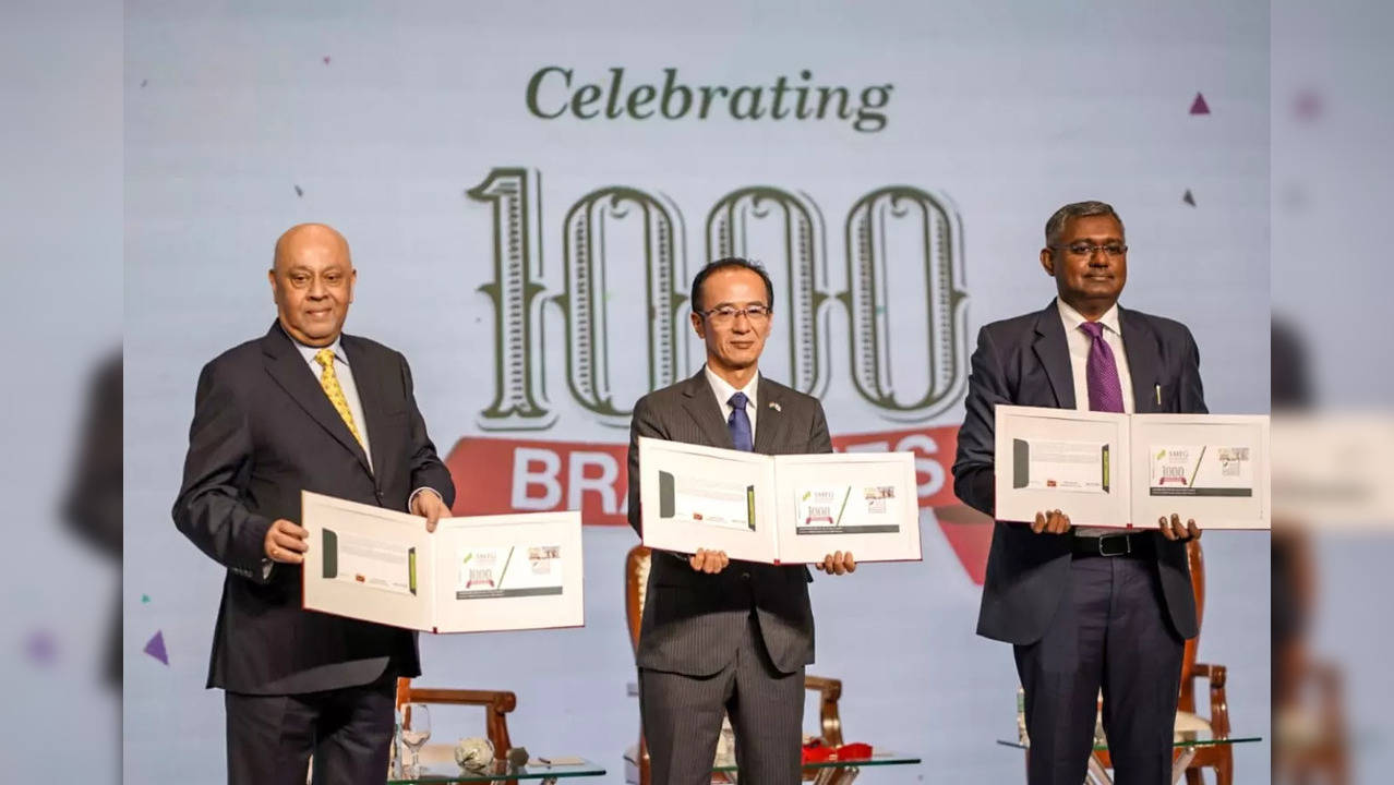 Image Caption : SMFG India Credit's 1000th branch launch celebrated with a special cover release. Mr. Shantanu Mitra, Mr. Yagi Koji, and Mr. Abhijeet Bansode attended.