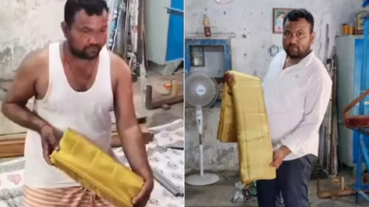 Nalla Vijay Kumar, weaver in Sircilla, Telangana, poses with the gold saree he made for a Hyderabad businessman's daughter.