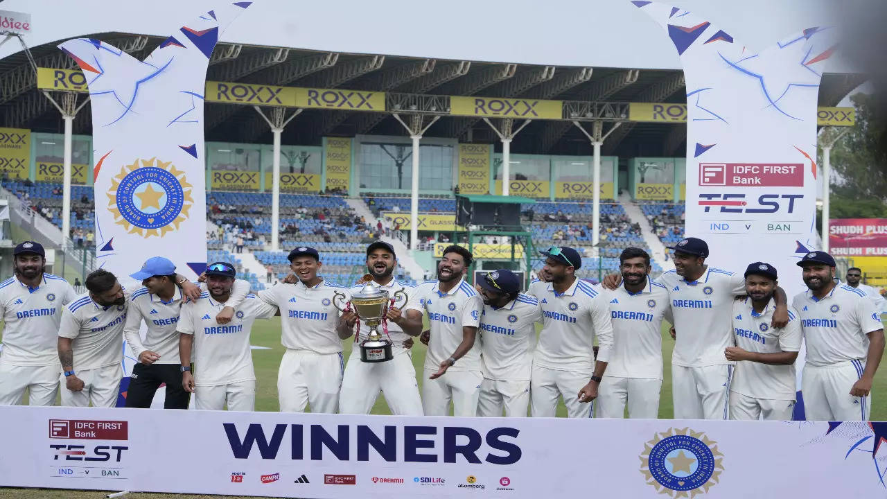 Indian players celebrate with the trophy