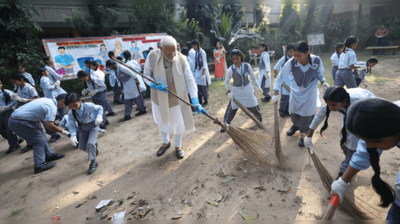 PM Modi picks up the broom for cleanliness drive with school kids