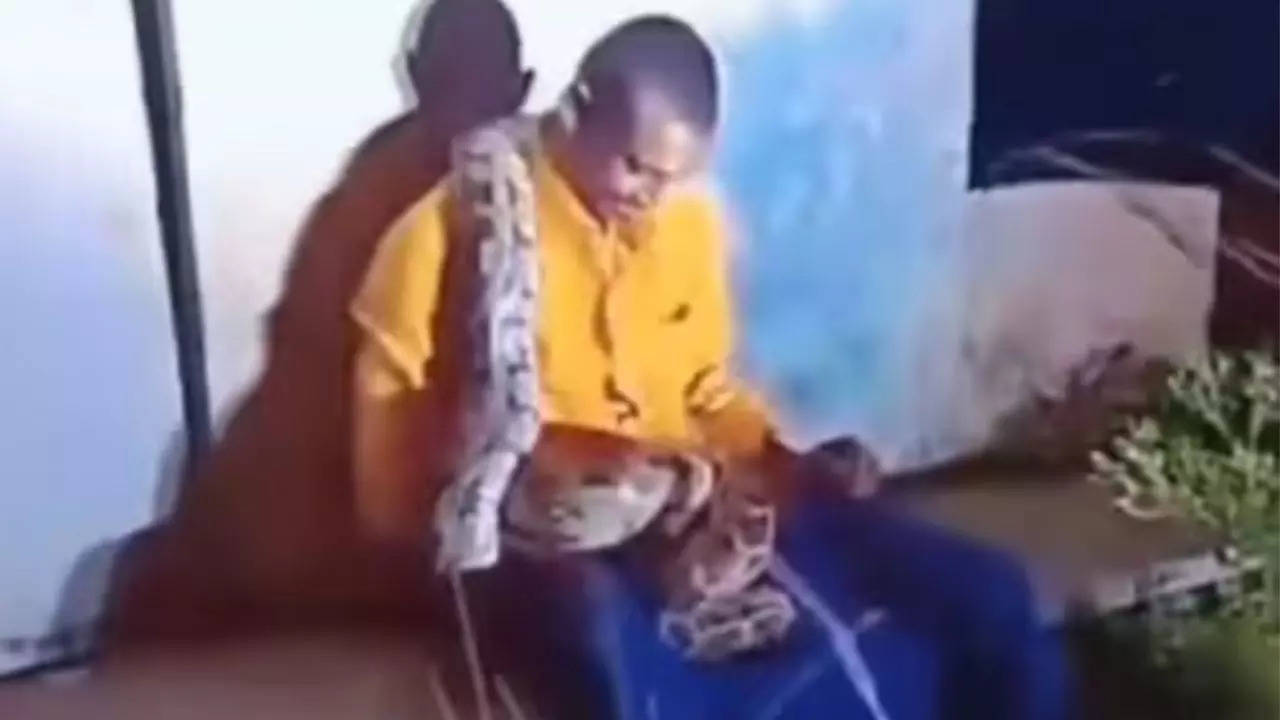 Andhra Pradesh: A giant python was coiled around a drunk man