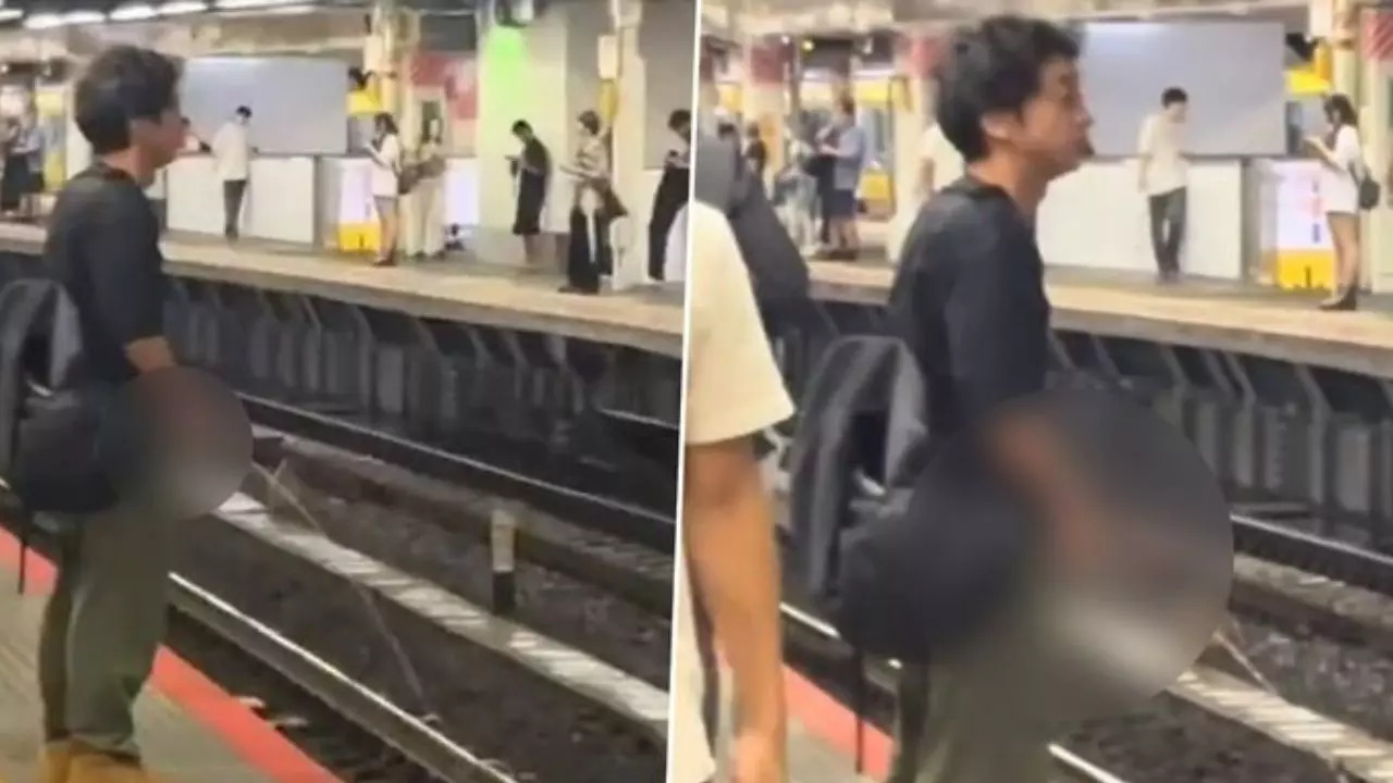 After several moments, a railway staff member intervened and escorted the man away without any resistance.