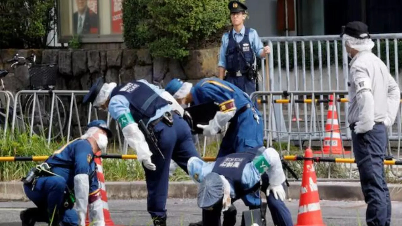 Tokyo Police inspect the aftermath of the incident