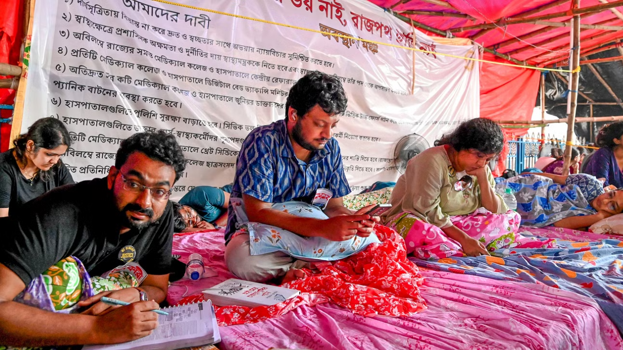 Junior doctors sit on fast to protest over the alleged rape and murder of a trainee doctor at the RG Kar Medical College and Hospital, in Kolkata