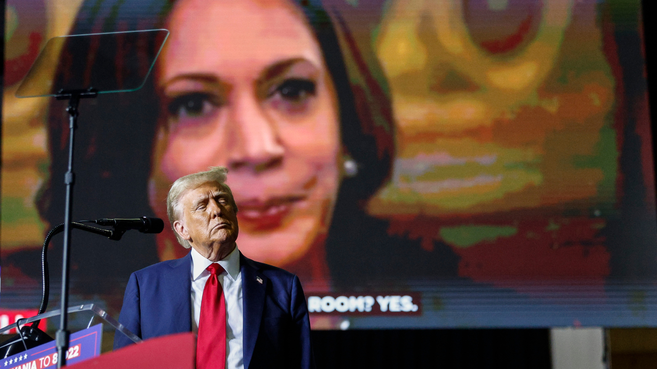 Donald Trump with Kamala Harris in the background