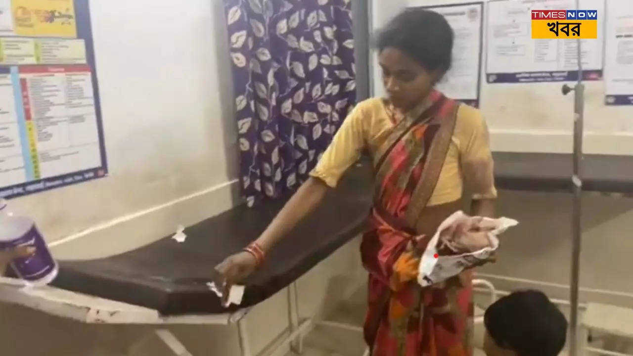 Woman Cleaning hospital bed