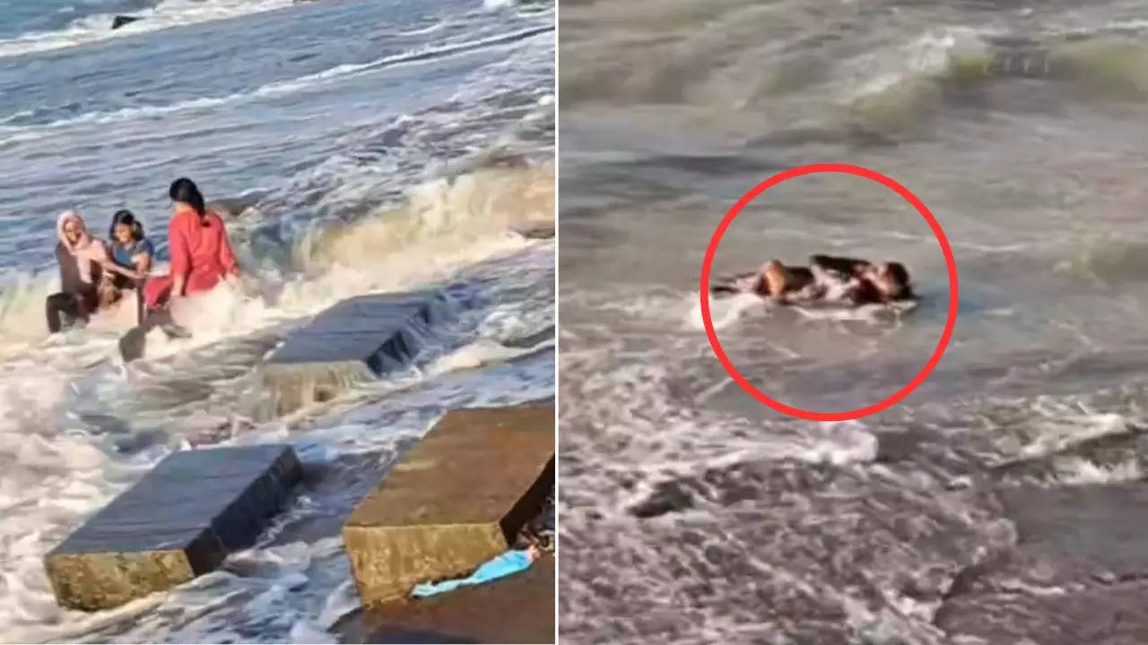 girls were having fun sitting on the beach then wave came and pulled them inside