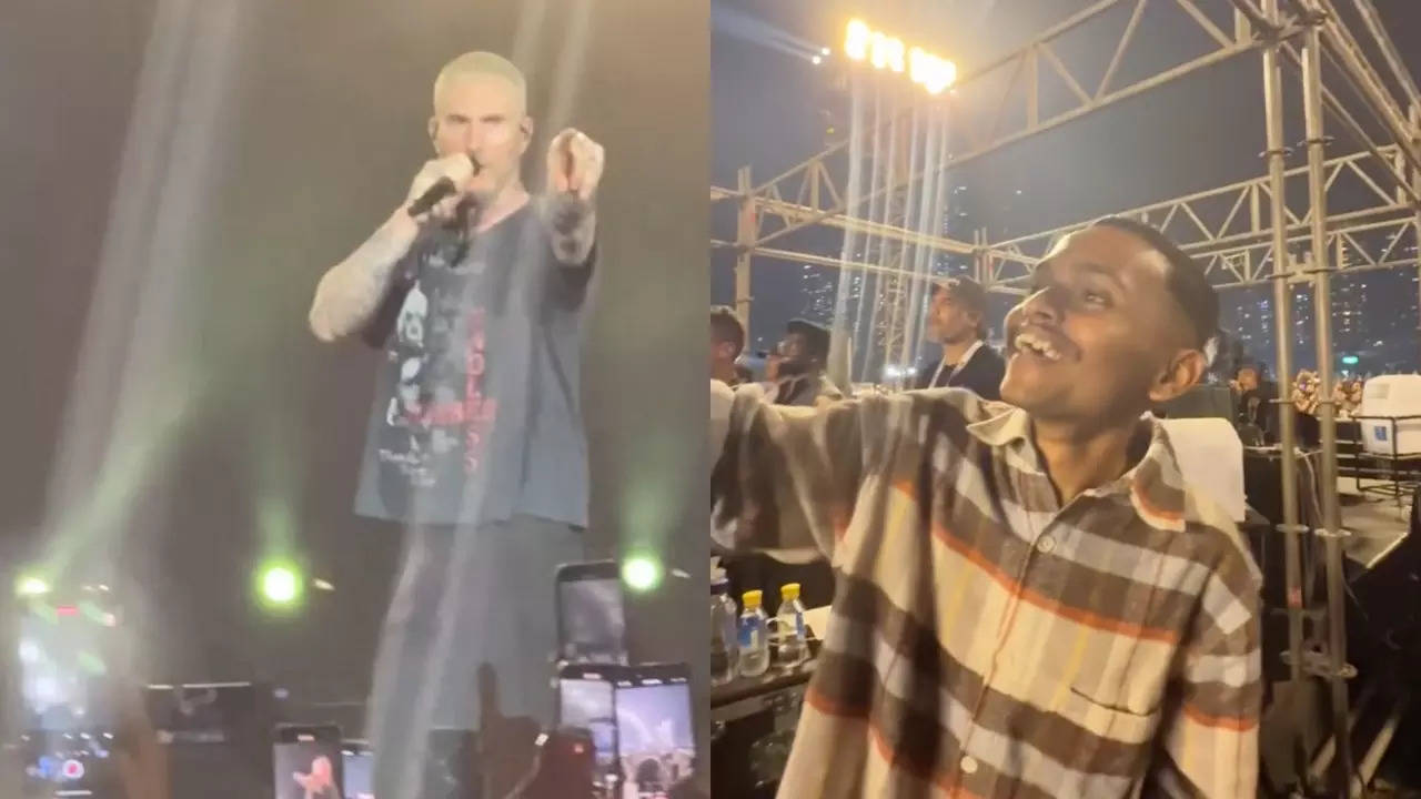 Maroon 5 frontman Adam Levine acknowledges Darshan Magdum during the band's concert in Mumbai.