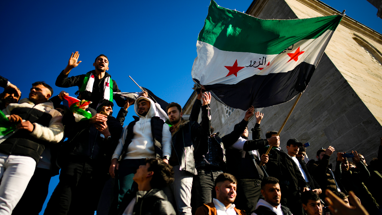 People gather to celebrate the Syrian government fall at Faith mosque in Istanbul, Turkey, Sunday, Dec. 8, 2024