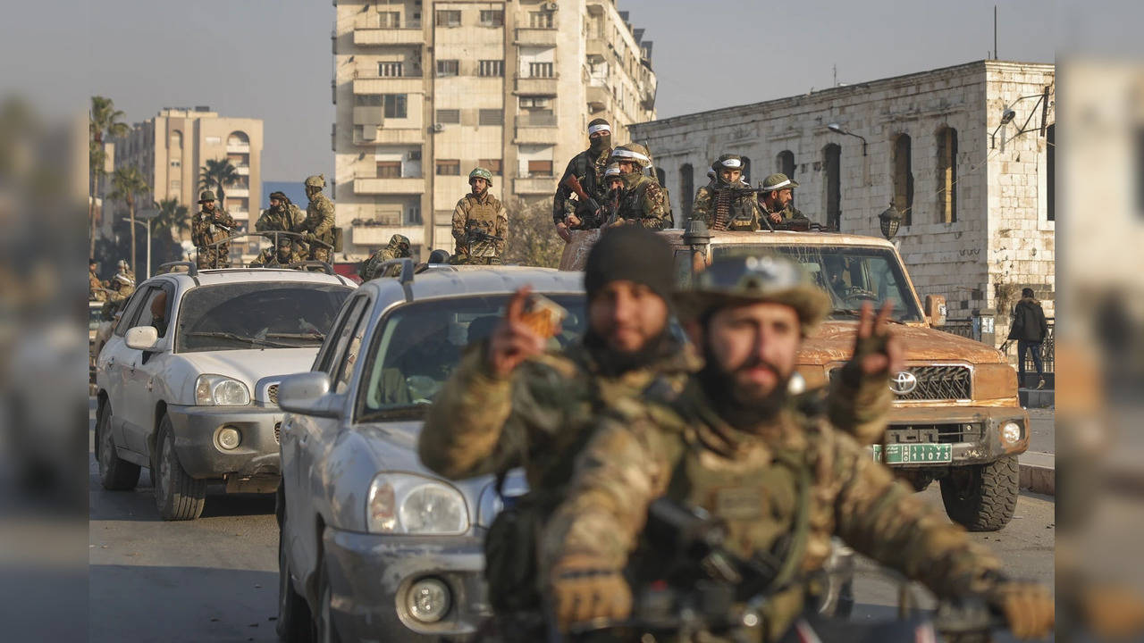 Syrian Opposition fighters ride along streets