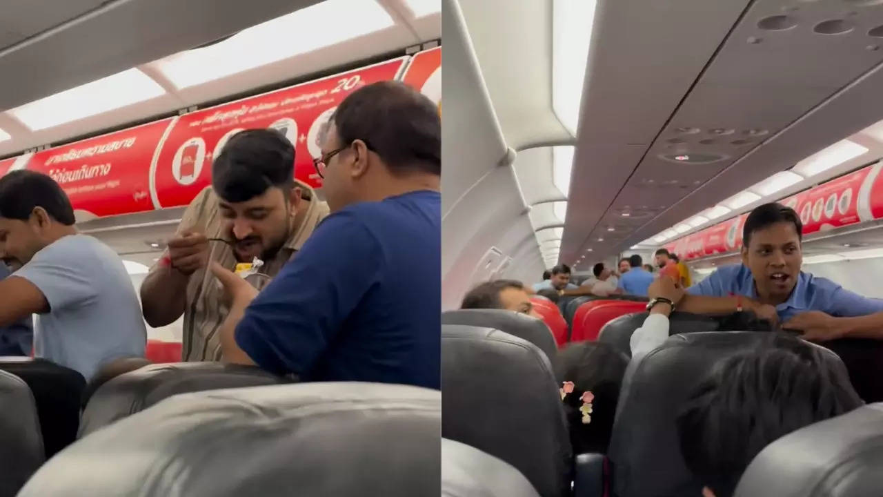 Indians stand in the aisle of a plane mid-flight to Thailand. | Image courtesy: Ankit Kumar