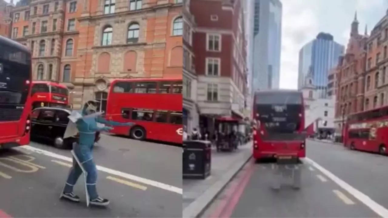 Man Blends Perfectly Into Bus and Street with Mind-Boggling Handstand Stunt