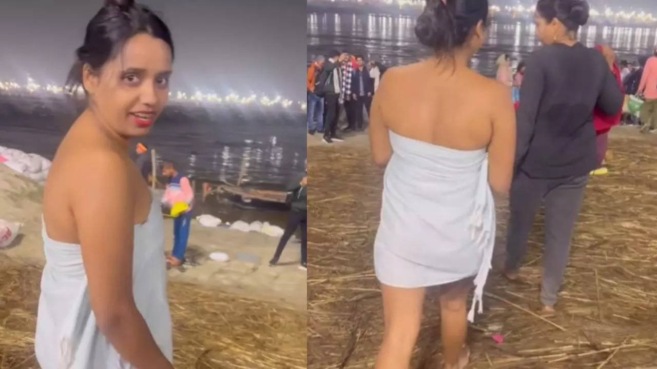 maha kumbh mela 2025 a girl wear towel for bathing in maha kumbh punno snan and roaming around ganga ghat (2)