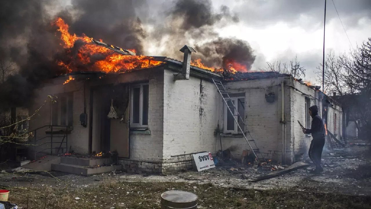 A house is on fire following shelling on the town of Irpin, west of Kyiv