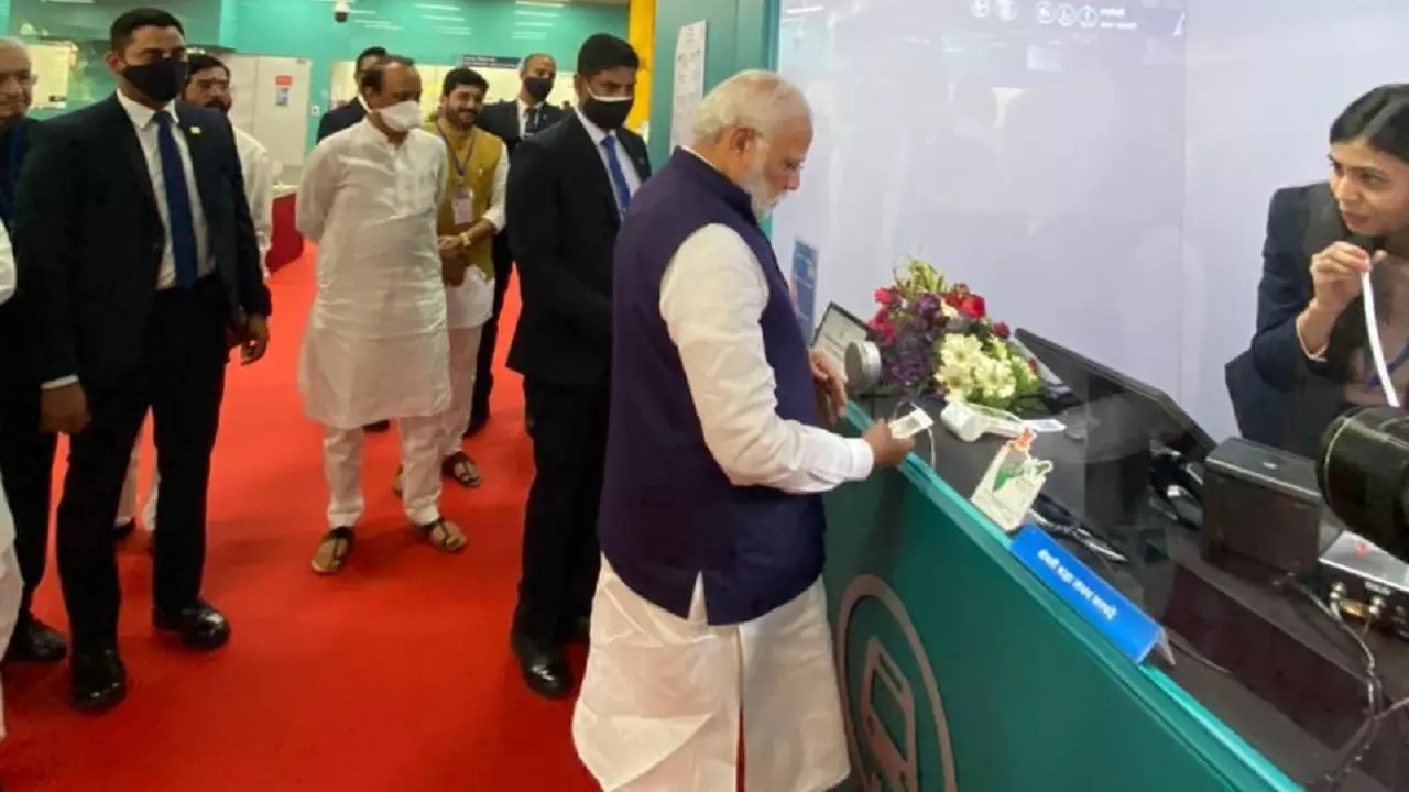 Prime Minister Narendra Modi buys ticket before travelling on Pune Metro