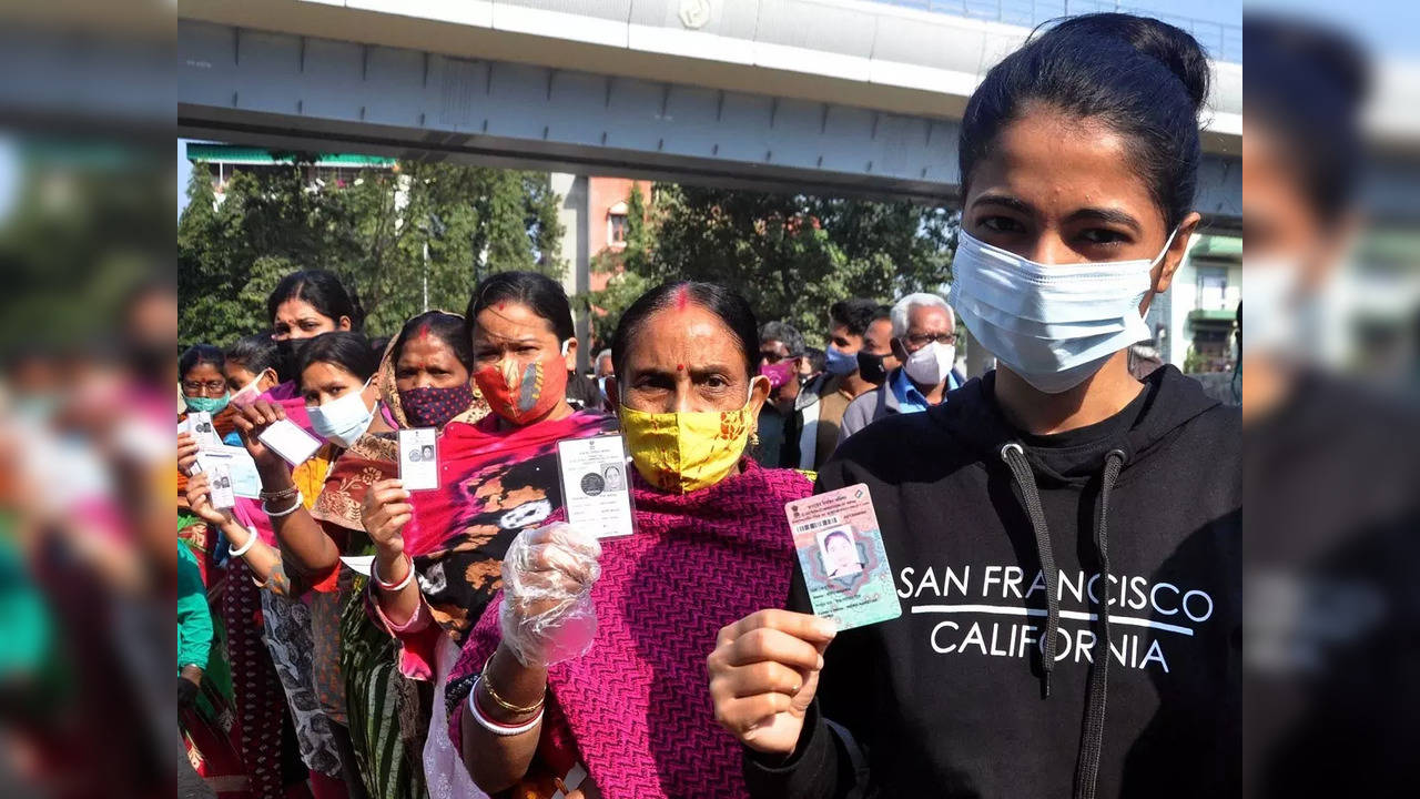 Women show their identity cards as they wait to cast their votes during Bidhan Nagar Municipal Corporation Election in Kolkata | Representational image