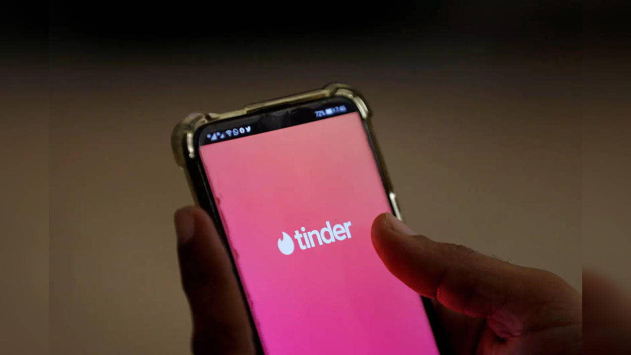 The dating app Tinder is shown on a mobile phone in this picture illustration