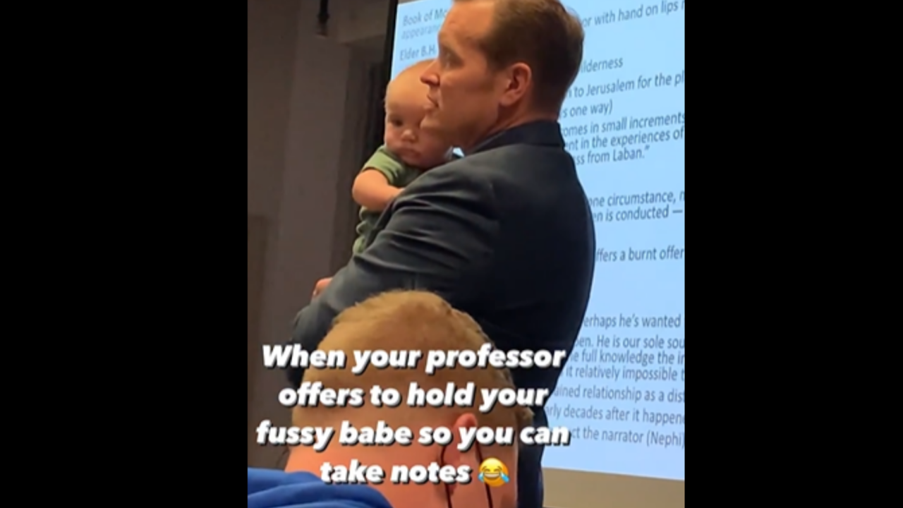 Professor holds baby