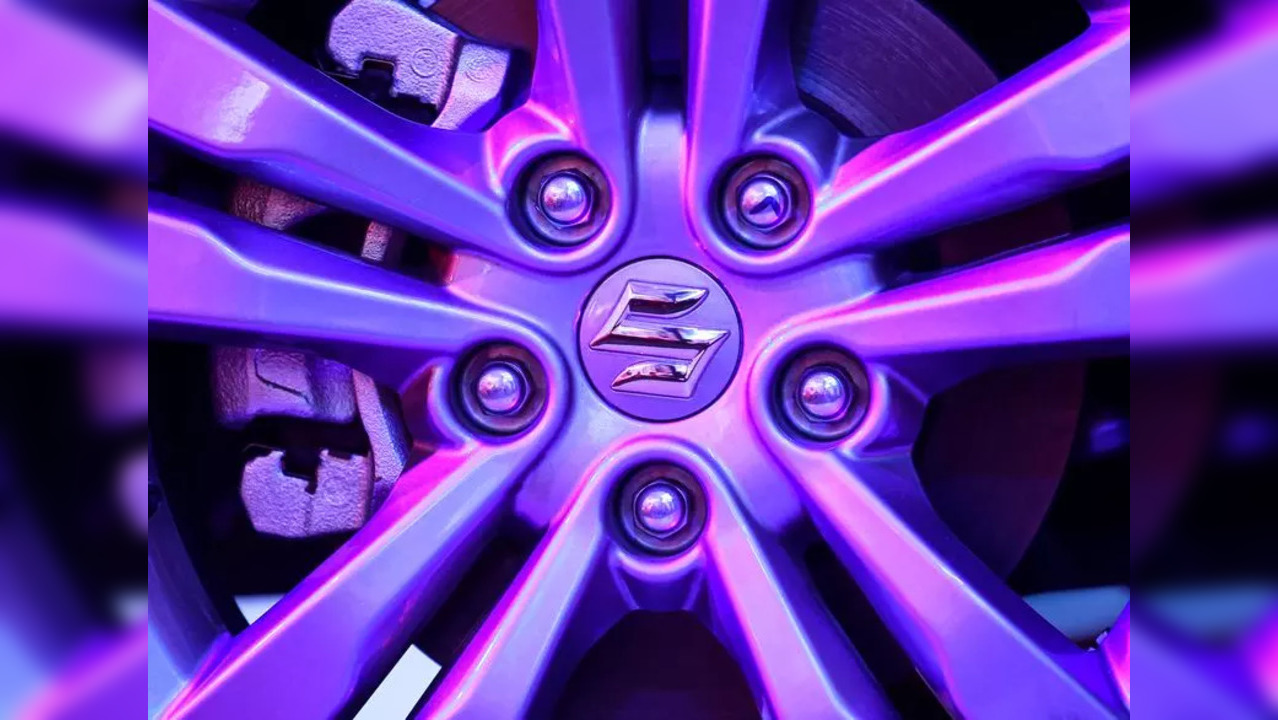 FILE PHOTO: The logo of Suzuki is seen on a wheel of Maruti Suzuki Vitara Brezza car during its launch in Mumbai