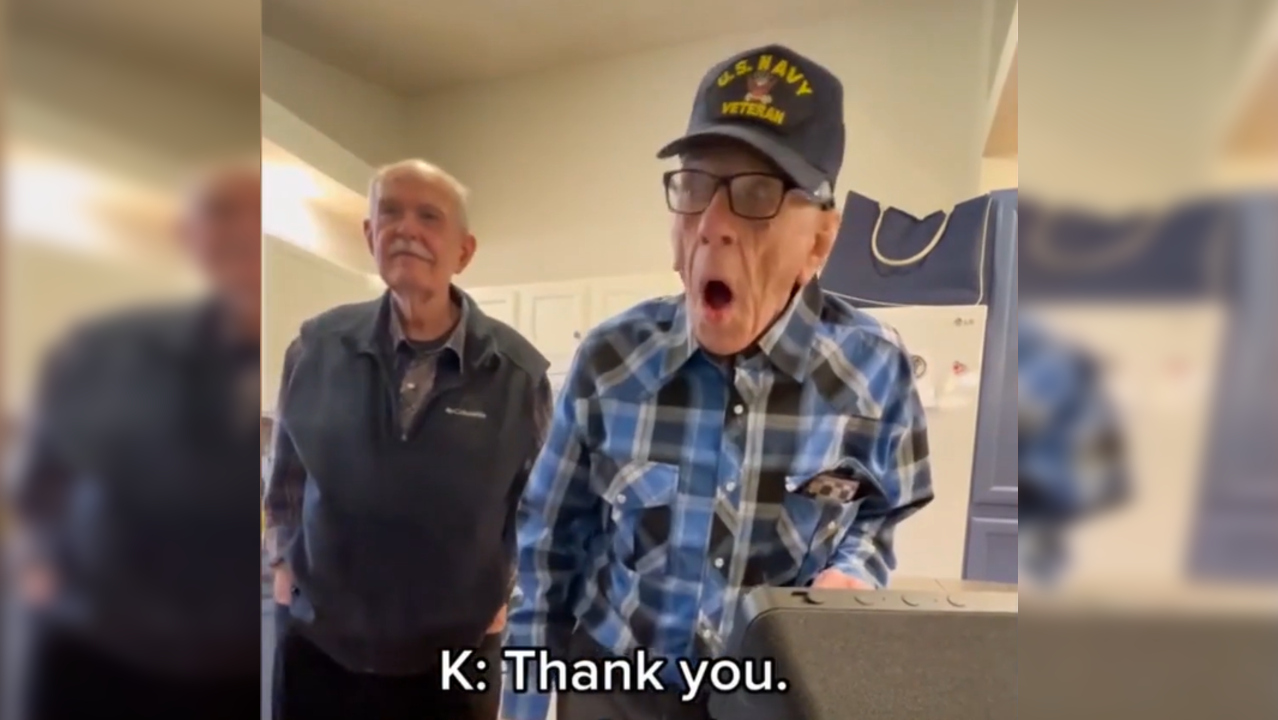 Elderly man happy after receiving gift