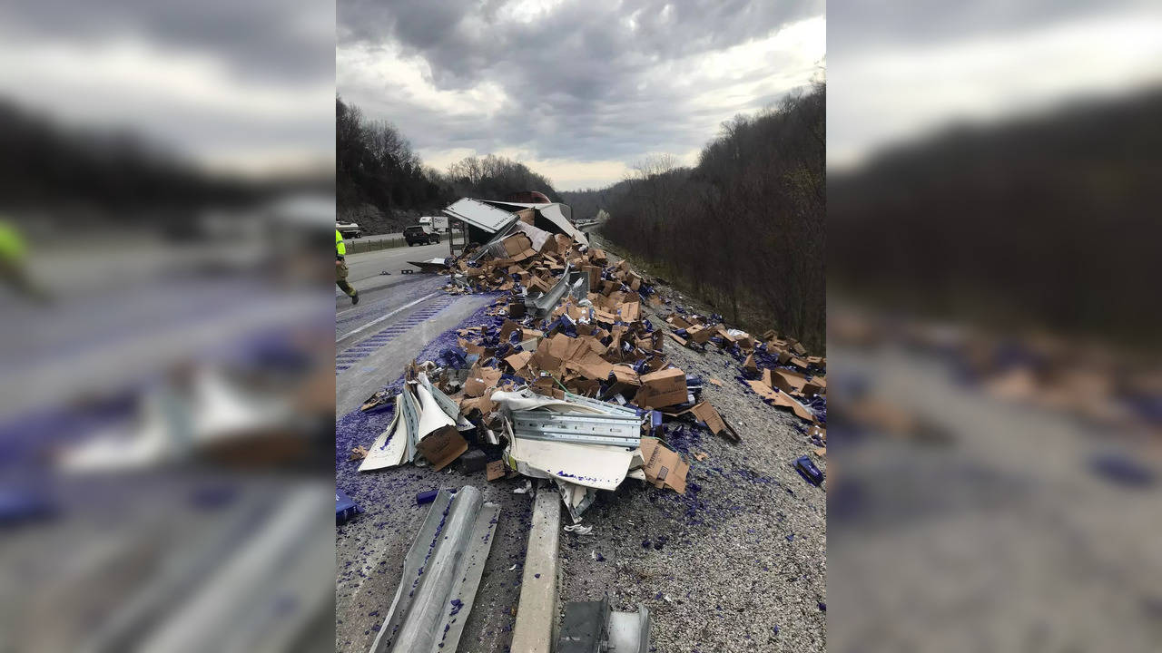 Truck overturns and spills hundreds of bottles of beer