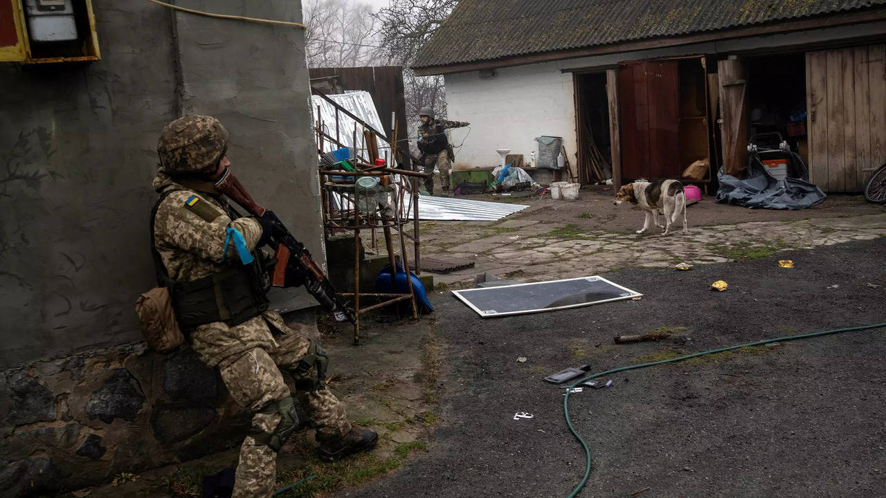 ​Ukrainian soldiers operate inside an abandoned house during a military sweep to search for possible remnants of Russian troops after their withdrawal from villages in the outskirts of Kyiv